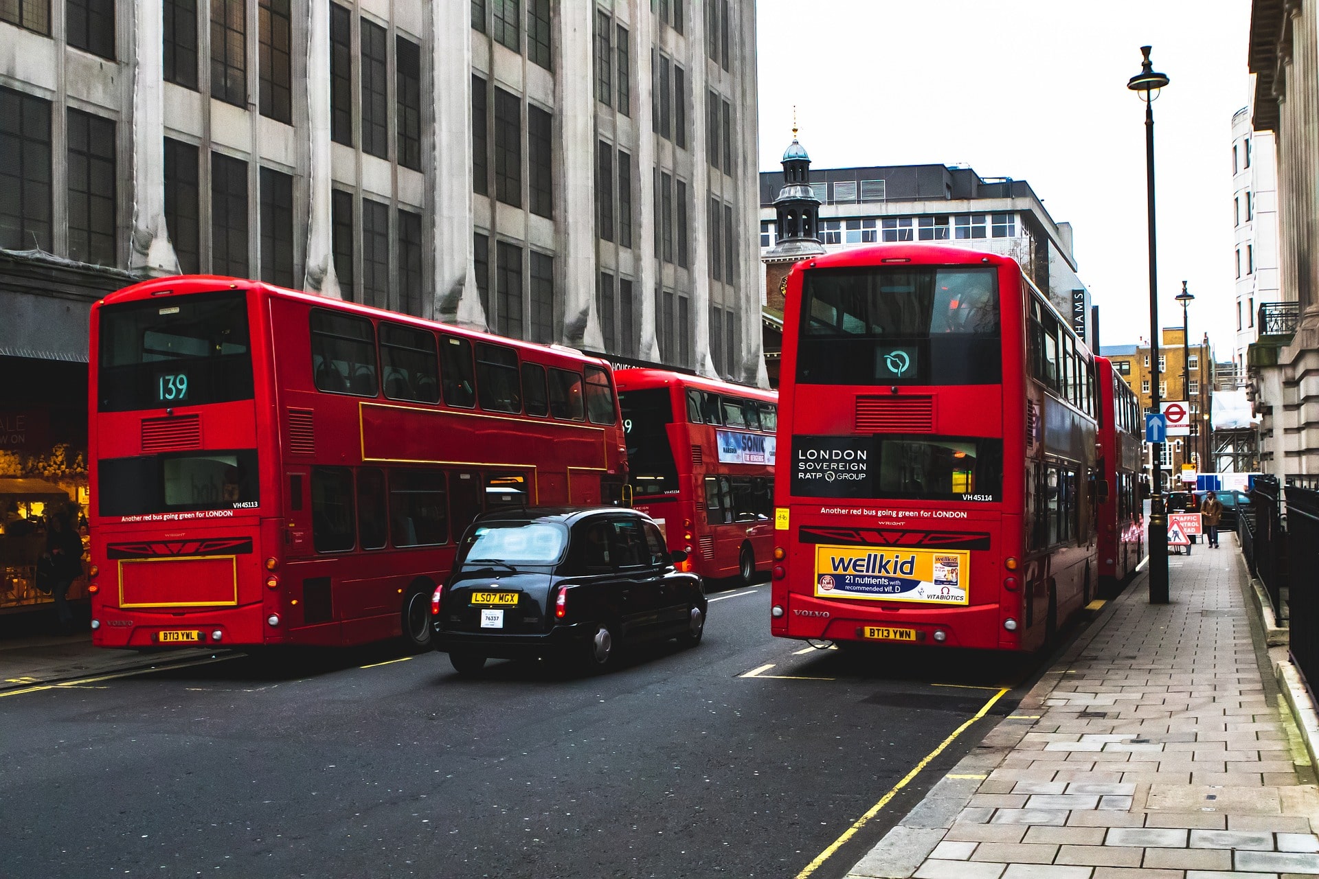 A group of UK buses on the roads, which have different types of security in place.